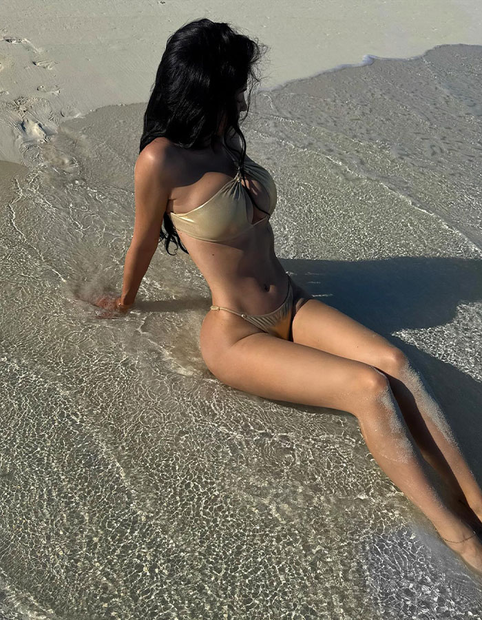 Netizens Suspicious As Kylie Jenner Flaunts Round Butt In A Revealing Golden Bikini 4