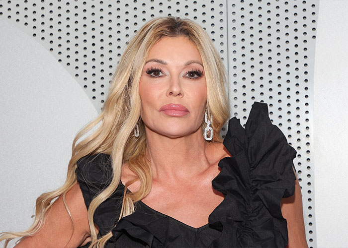 “Psychosis On Display”: Brandi Glanville Goes Bold In Red Bikini After Face Disfigurement Diagnosis 1